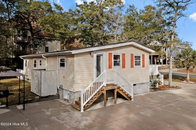 view of front facade with a patio area