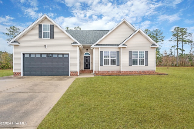 view of front of house featuring a front yard and a garage