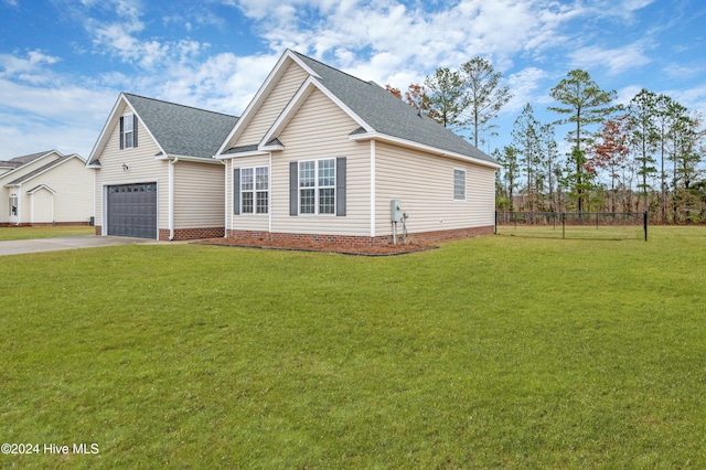 view of front of property featuring a garage and a front lawn