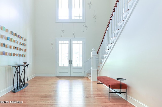 215 Inverrary Rd, Pinehurst, NC 28374 - foyer entrance featuring a towering ceiling, stairs, wood finished floors, and healthy amount of natural light