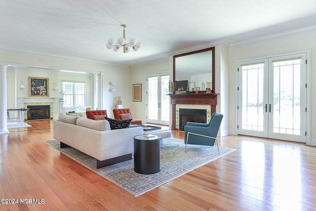 215 Inverrary Rd, Pinehurst, NC 28374 - living area featuring a fireplace, healthy amount of natural light, light wood finished floors, and ornamental molding