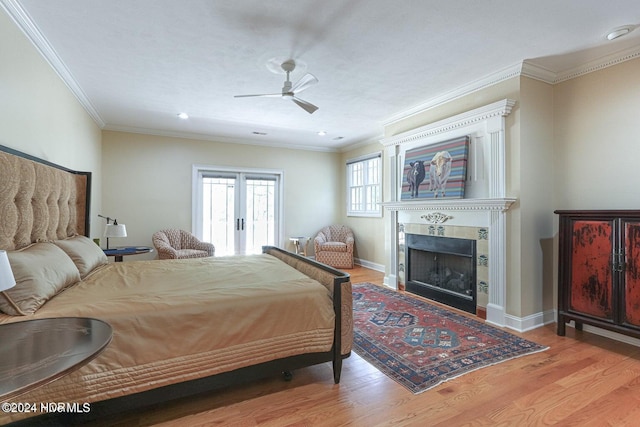 215 Inverrary Rd, Pinehurst, NC 28374 - bedroom featuring wood finished floors, crown molding, a fireplace, recessed lighting, and a ceiling fan