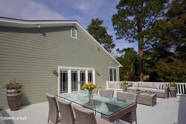 215 Inverrary Rd, Pinehurst, NC 28374 - wooden deck featuring an outdoor living space, outdoor dining area, and a patio area