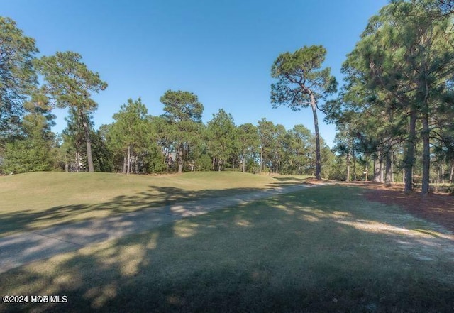 215 Inverrary Rd, Pinehurst, NC 28374 - view of home's community featuring a lawn
