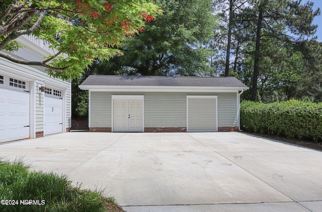 215 Inverrary Rd, Pinehurst, NC 28374 - garage featuring concrete driveway
