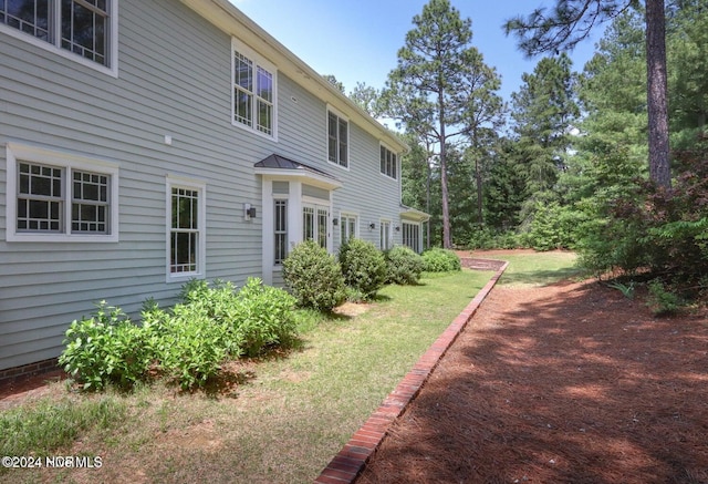 215 Inverrary Rd, Pinehurst, NC 28374 - rear view of house with a lawn