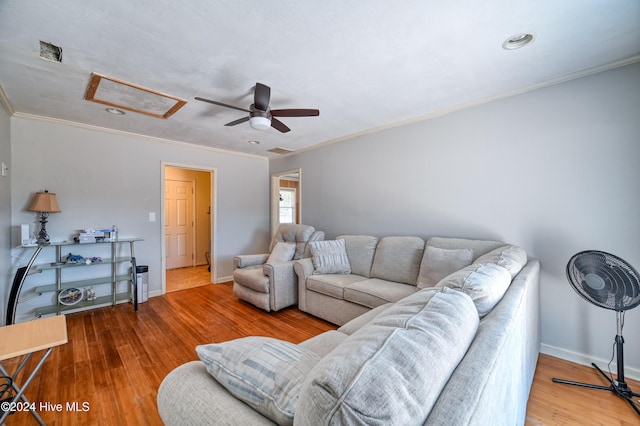 living room featuring crown molding, ceiling fan, and hardwood / wood-style floors