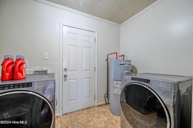 clothes washing area featuring crown molding, washing machine and dryer, electric water heater, a textured ceiling, and light tile patterned flooring