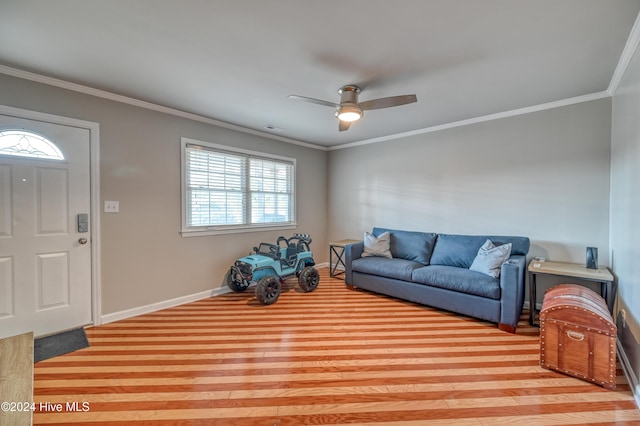 living room featuring crown molding and ceiling fan