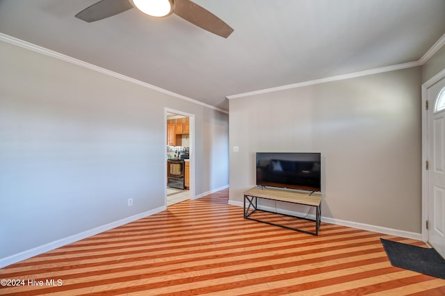 living room featuring crown molding and ceiling fan