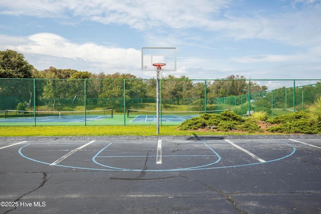 view of sport court featuring tennis court