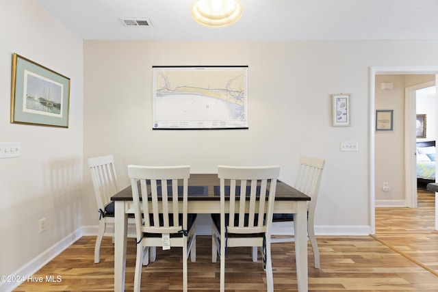 dining area with wood-type flooring