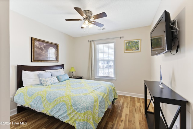 bedroom featuring ceiling fan and hardwood / wood-style flooring