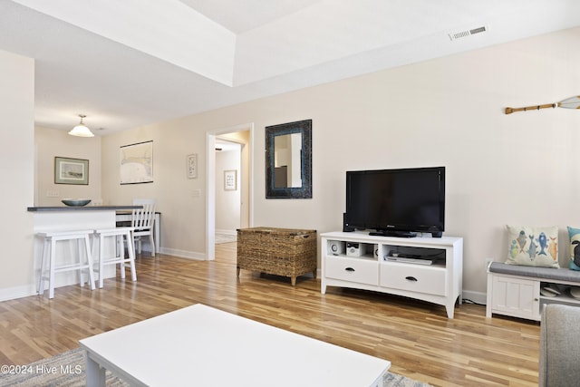 living room with light hardwood / wood-style floors