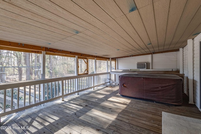 wooden deck featuring a hot tub