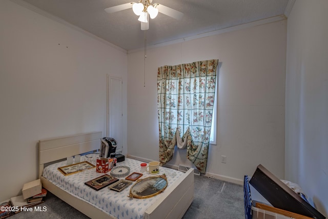 carpeted bedroom featuring ceiling fan, a textured ceiling, and ornamental molding