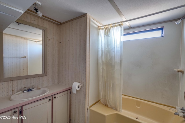 bathroom with shower / tub combo with curtain and vanity