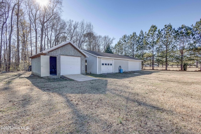 garage with a yard