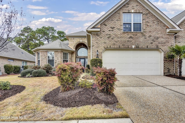 front of property with a garage