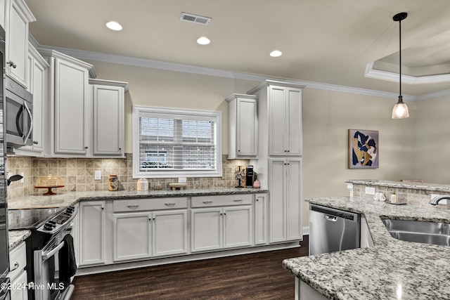 kitchen with pendant lighting, sink, white cabinetry, and stainless steel appliances