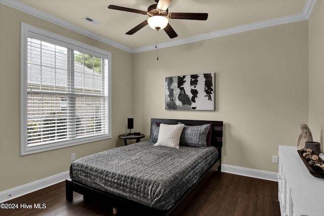 bedroom with crown molding, ceiling fan, and dark hardwood / wood-style flooring