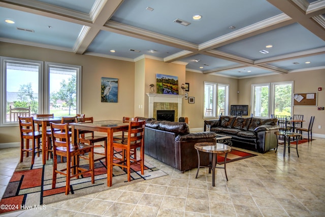 tiled living room featuring a wealth of natural light, a tile fireplace, beamed ceiling, and coffered ceiling