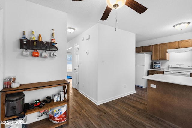 kitchen with dark hardwood / wood-style flooring, white appliances, a textured ceiling, and ceiling fan