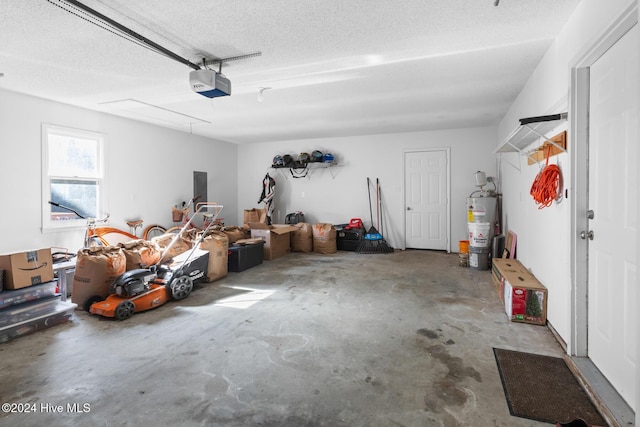 garage with water heater and a garage door opener