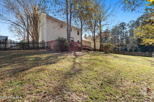 view of yard with a wooden deck