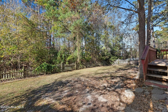 view of yard featuring a wooden deck