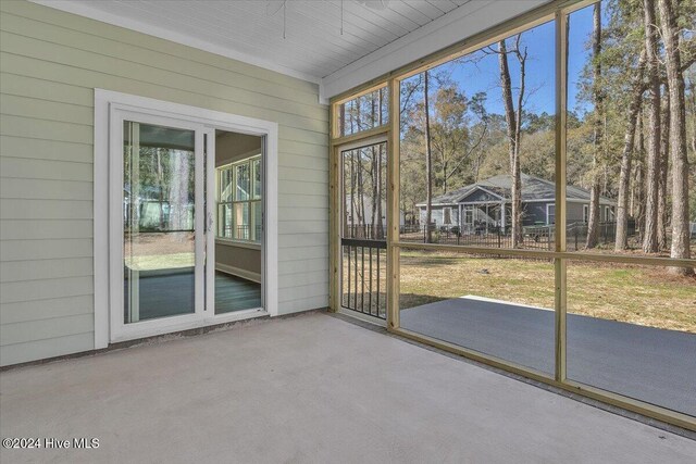 unfurnished sunroom with plenty of natural light