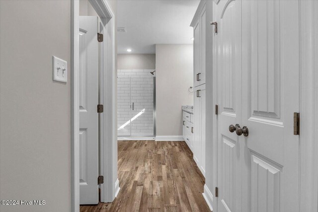 hallway featuring hardwood / wood-style floors