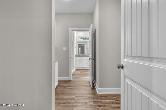 hallway featuring hardwood / wood-style flooring