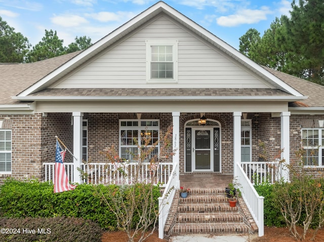 view of front of property featuring covered porch