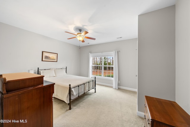 carpeted bedroom with ceiling fan