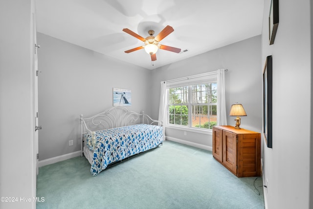 carpeted bedroom featuring ceiling fan