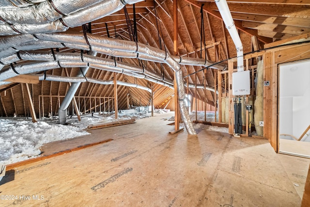 attic featuring tankless water heater