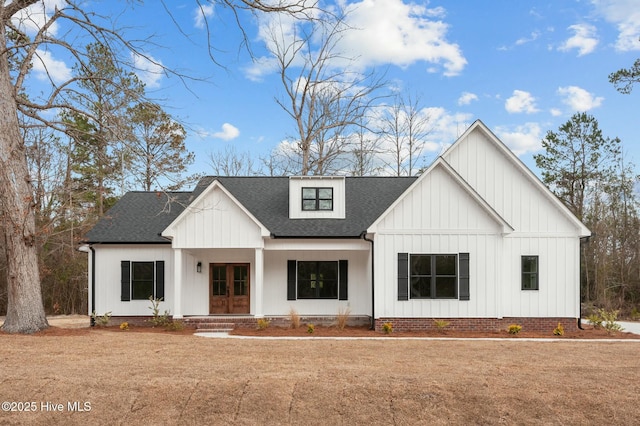 modern farmhouse featuring a shingled roof and board and batten siding