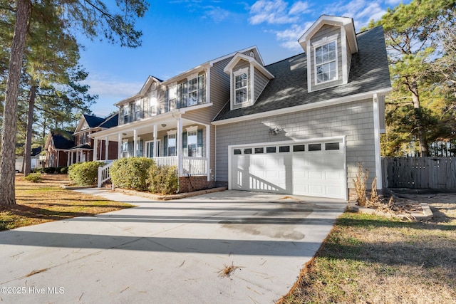 view of front of property featuring covered porch and a garage