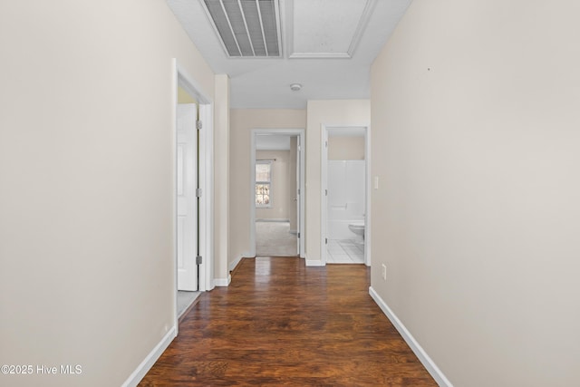 hallway with dark hardwood / wood-style floors