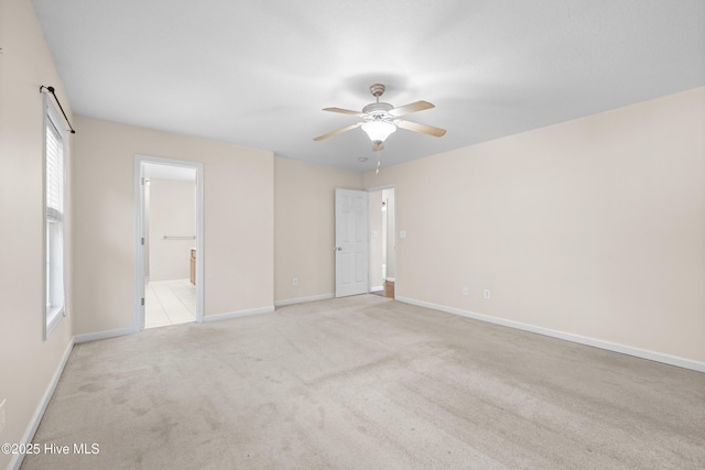 carpeted empty room with ceiling fan