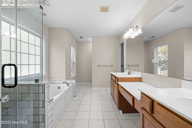 bathroom with tile patterned floors, vanity, and independent shower and bath