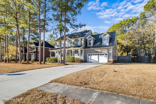 view of front of house featuring a porch and a garage