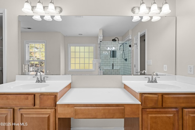 bathroom with vanity and a shower with door