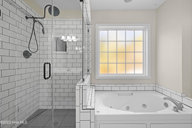 bathroom featuring shower with separate bathtub