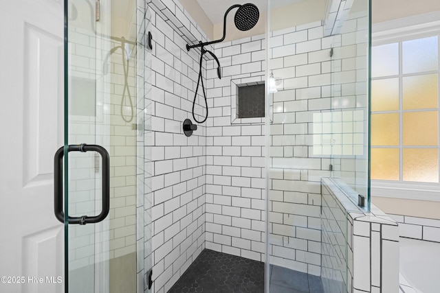 bathroom with a shower with shower door