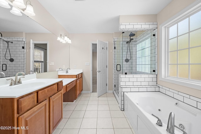 bathroom featuring tile patterned floors, vanity, and separate shower and tub