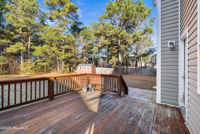 wooden terrace with a storage unit