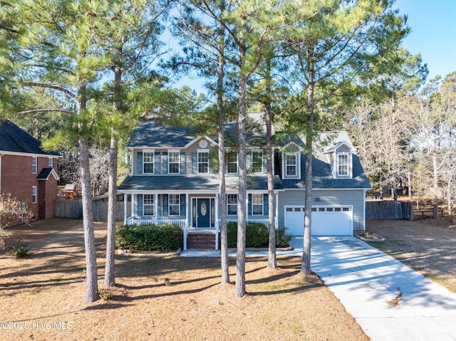 view of front of home with covered porch and a garage