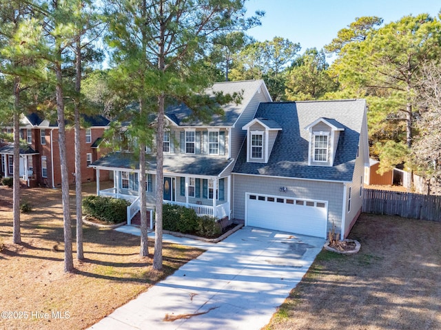 view of front of property featuring covered porch and a garage